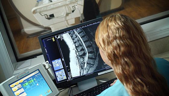 woman looking at mri screen